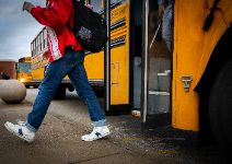  Boy stepping off school bus